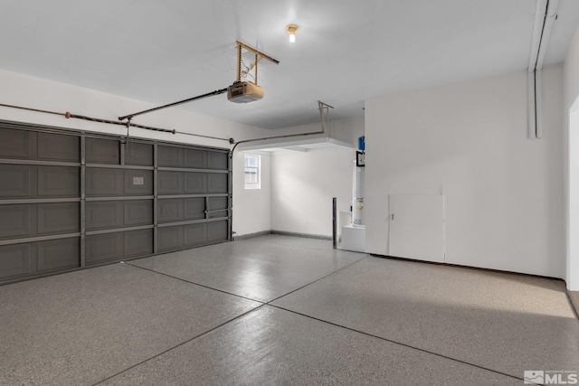 garage with secured water heater and a garage door opener