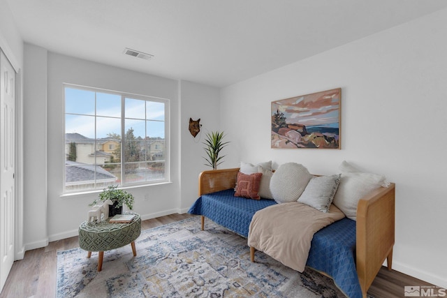 living area with hardwood / wood-style flooring