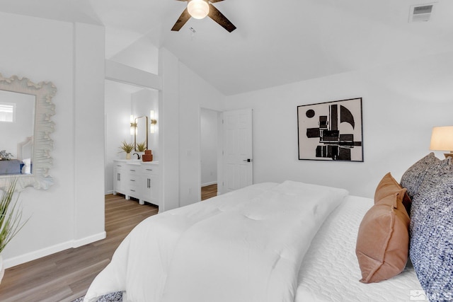 bedroom with vaulted ceiling, wood-type flooring, and ceiling fan