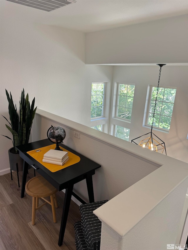 dining room featuring a notable chandelier and wood-type flooring