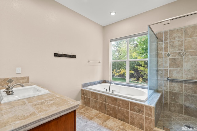 bathroom with separate shower and tub and sink