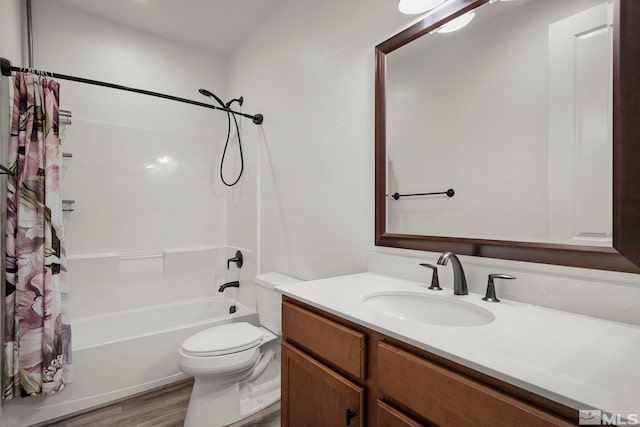 full bathroom featuring vanity, toilet, wood-type flooring, and shower / bath combo with shower curtain