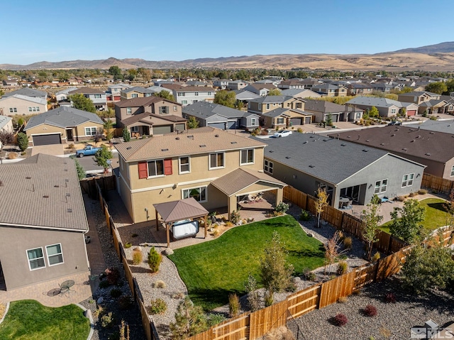 birds eye view of property with a mountain view