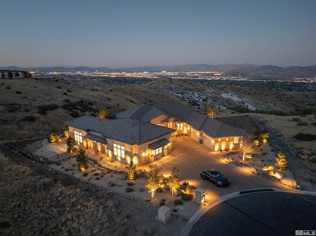 aerial view at dusk with a mountain view