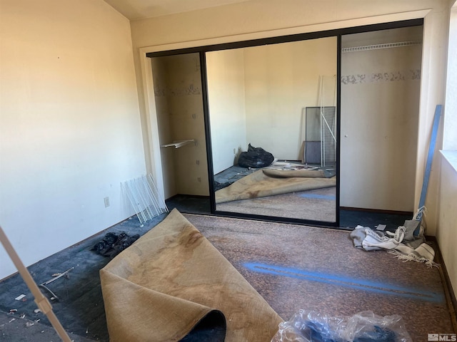 carpeted bedroom with a closet