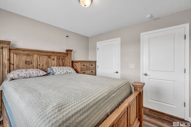 bedroom featuring dark wood-type flooring