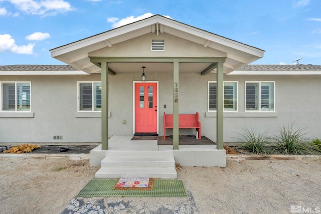 entrance to property with covered porch