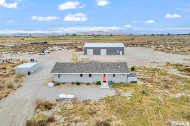 bird's eye view featuring a mountain view and a rural view