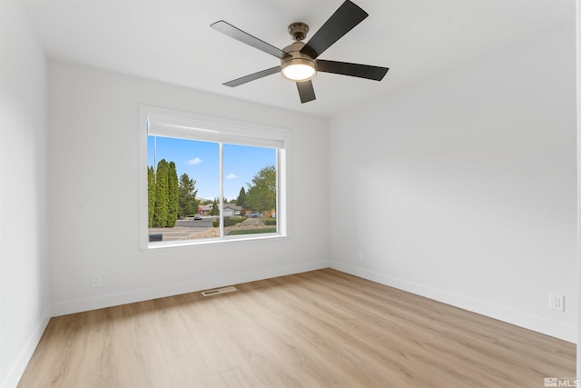 unfurnished room with ceiling fan and light hardwood / wood-style flooring