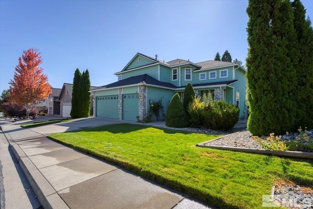 view of front of property featuring a front yard and a garage