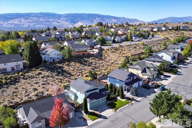 birds eye view of property with a mountain view