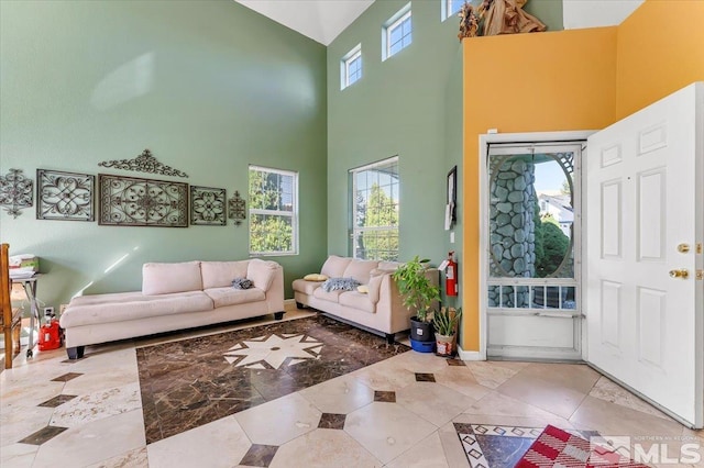 foyer entrance with a towering ceiling