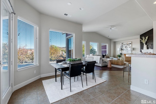 dining area with vaulted ceiling, tile patterned flooring, plenty of natural light, and ceiling fan