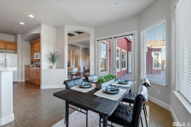 dining area featuring light tile patterned floors