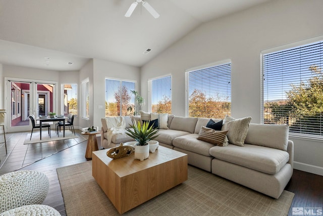 living room featuring ceiling fan, lofted ceiling, and hardwood / wood-style floors