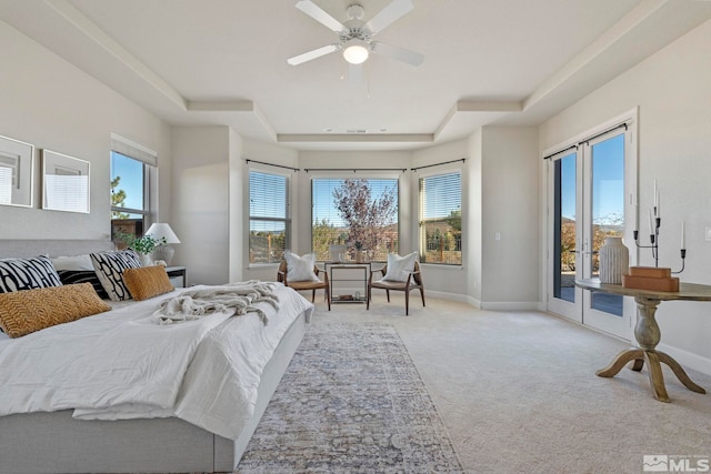 bedroom featuring access to outside, multiple windows, and ceiling fan