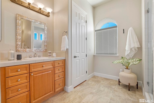 bathroom featuring vanity and a shower