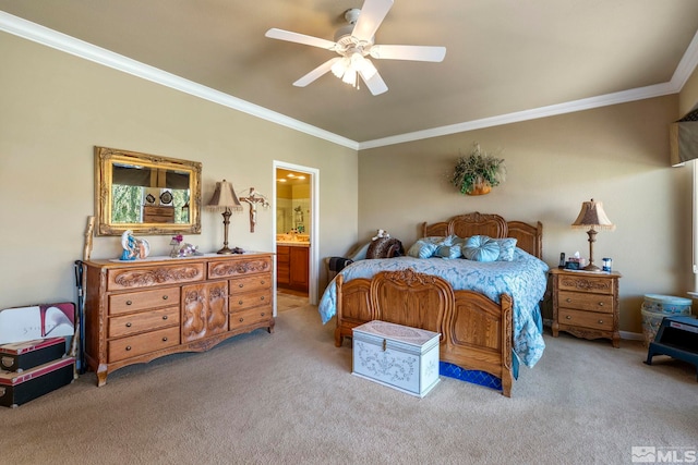 bedroom featuring ensuite bath, ornamental molding, light colored carpet, and ceiling fan