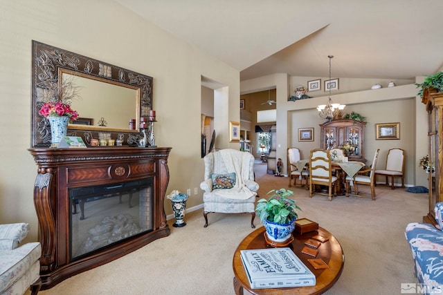 carpeted living room with an inviting chandelier and lofted ceiling