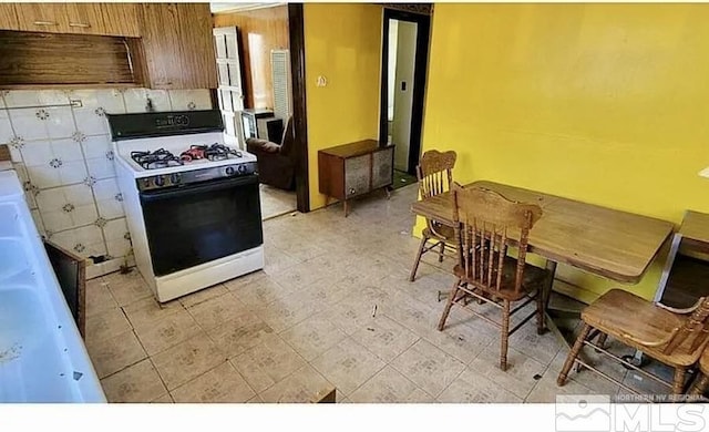 kitchen with white gas stove