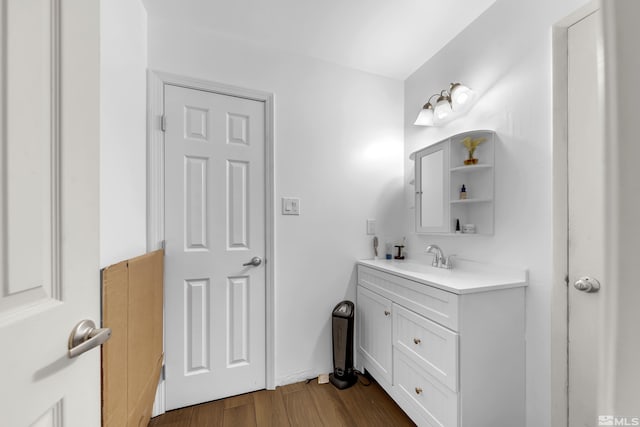 bathroom featuring hardwood / wood-style floors and vanity