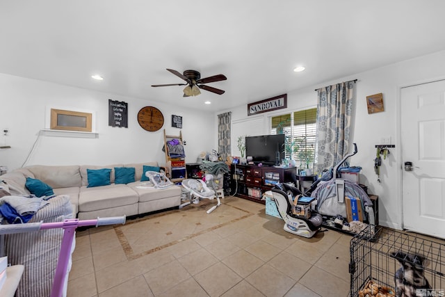 living room featuring ceiling fan and light tile patterned flooring