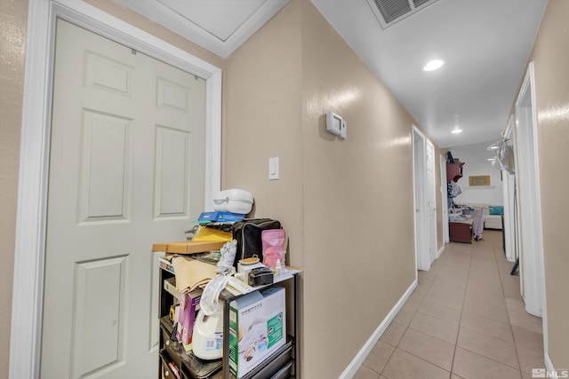 hall with light tile patterned floors