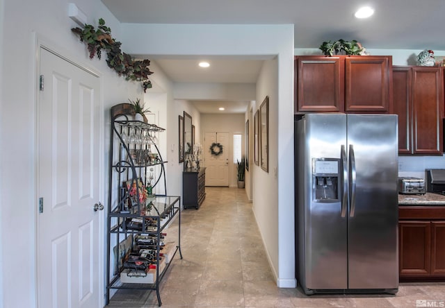 kitchen with stainless steel refrigerator with ice dispenser