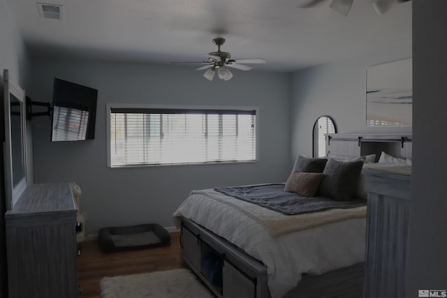 bedroom with wood-type flooring and ceiling fan