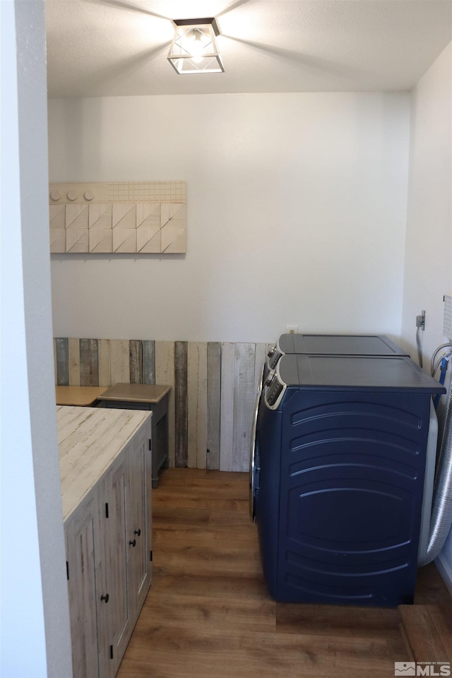 laundry area featuring washer / dryer and dark hardwood / wood-style flooring