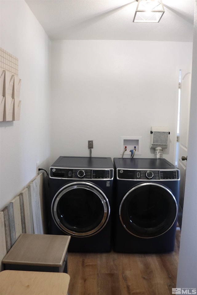 laundry room with independent washer and dryer and dark hardwood / wood-style flooring