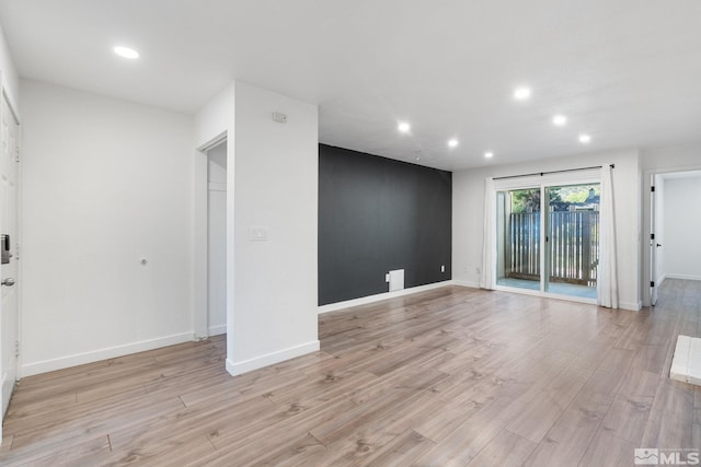 unfurnished room featuring light wood-type flooring