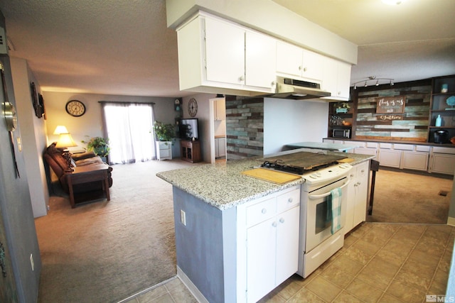 kitchen with light carpet, white range with gas stovetop, and white cabinets