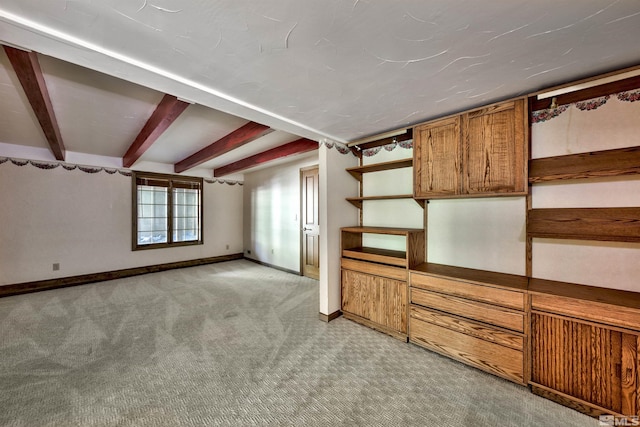 interior space with light carpet and beam ceiling