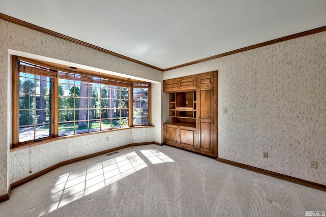 carpeted empty room with ornamental molding