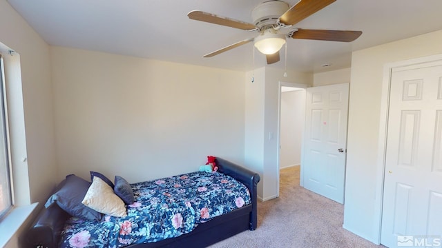 carpeted bedroom featuring ceiling fan