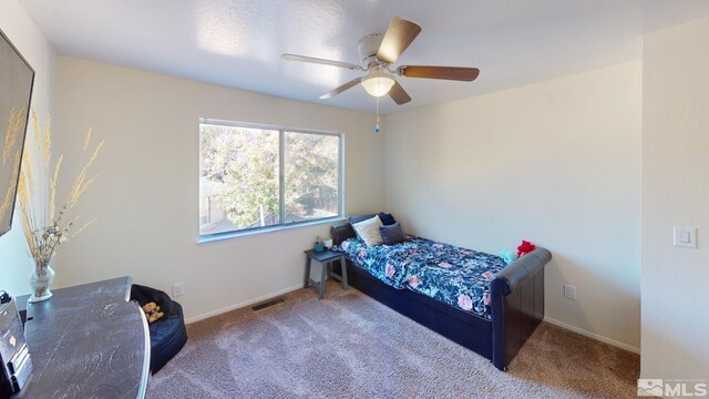 carpeted bedroom with ceiling fan