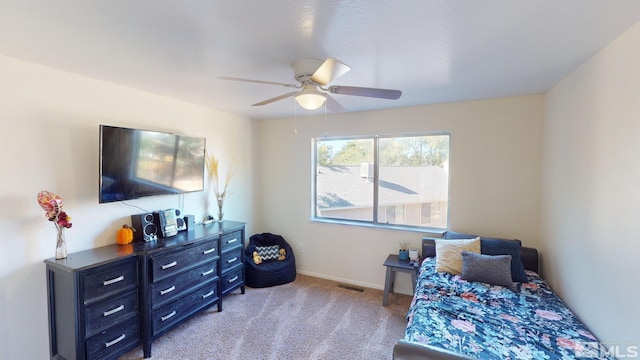 carpeted bedroom with ceiling fan