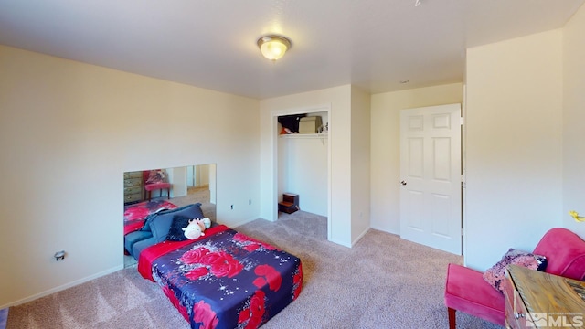 carpeted bedroom with a closet