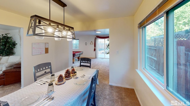 carpeted dining space with pool table