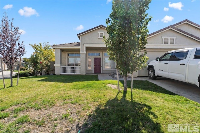 view of front of home with a porch, a front yard, and a garage