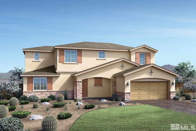 view of front facade with a garage and a front lawn