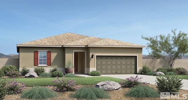 view of front of house featuring a front lawn and a garage