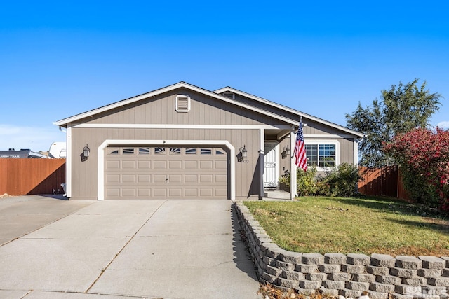 single story home featuring a garage and a front lawn