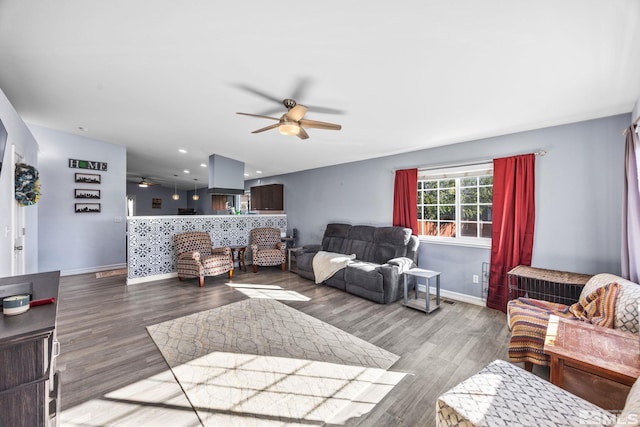 living room featuring hardwood / wood-style flooring and ceiling fan