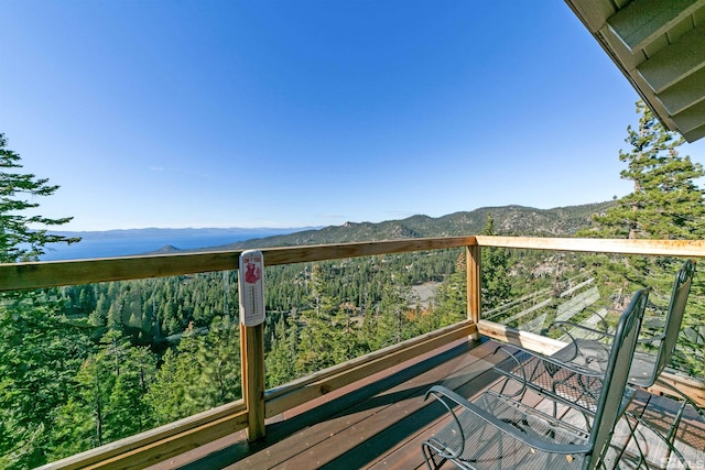 wooden deck featuring a mountain view