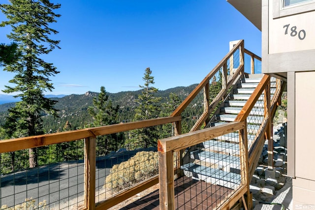 wooden terrace featuring a mountain view