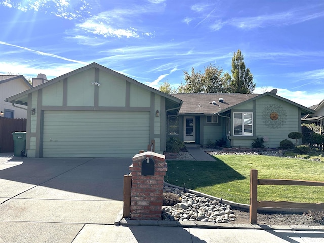 ranch-style house featuring a front lawn and a garage