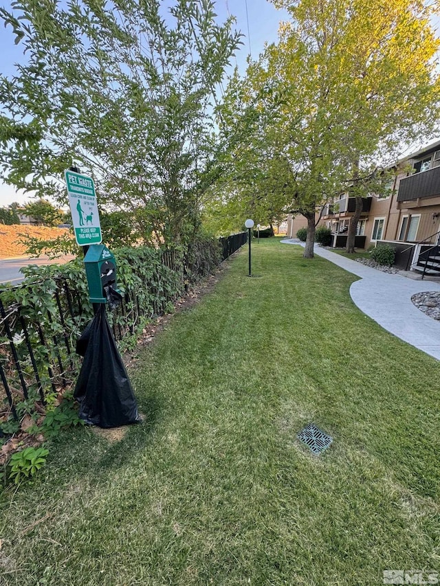 view of property's community featuring a yard