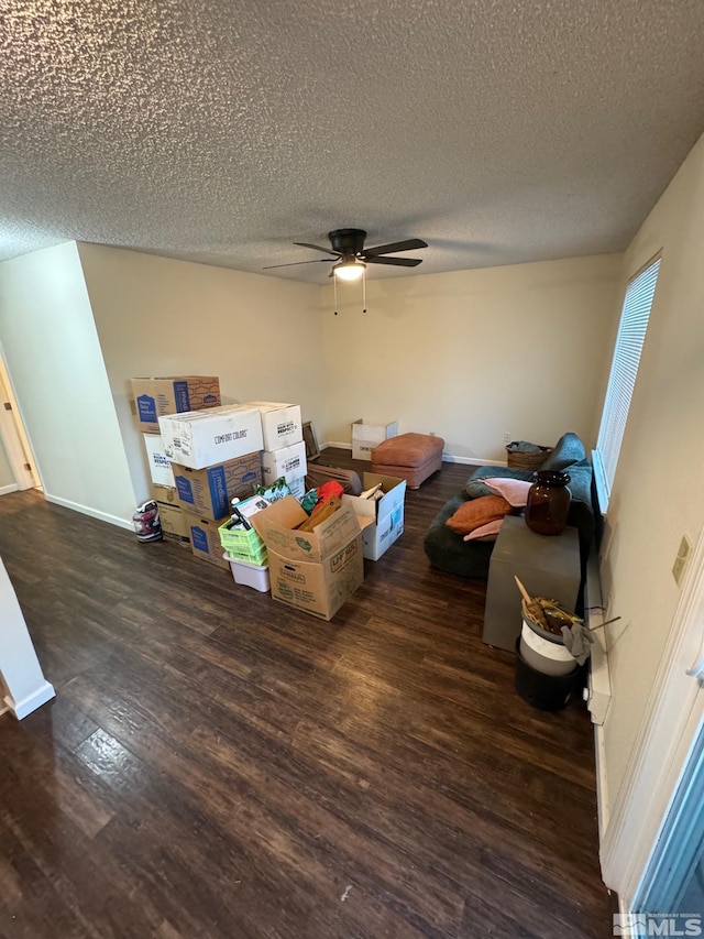 interior space with ceiling fan